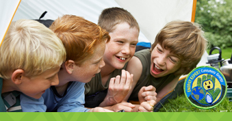 cub scouts in tent laughing